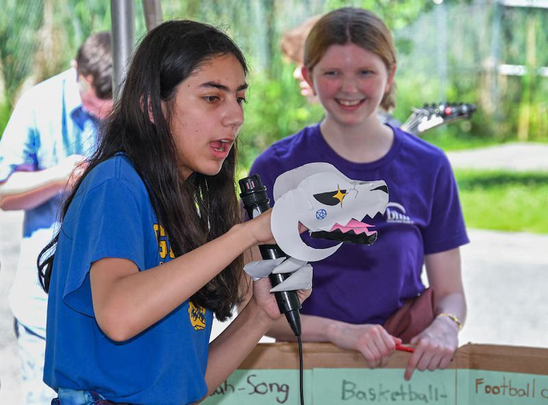 BHN kamp for kids opening day celebration - kids with paper dragon
