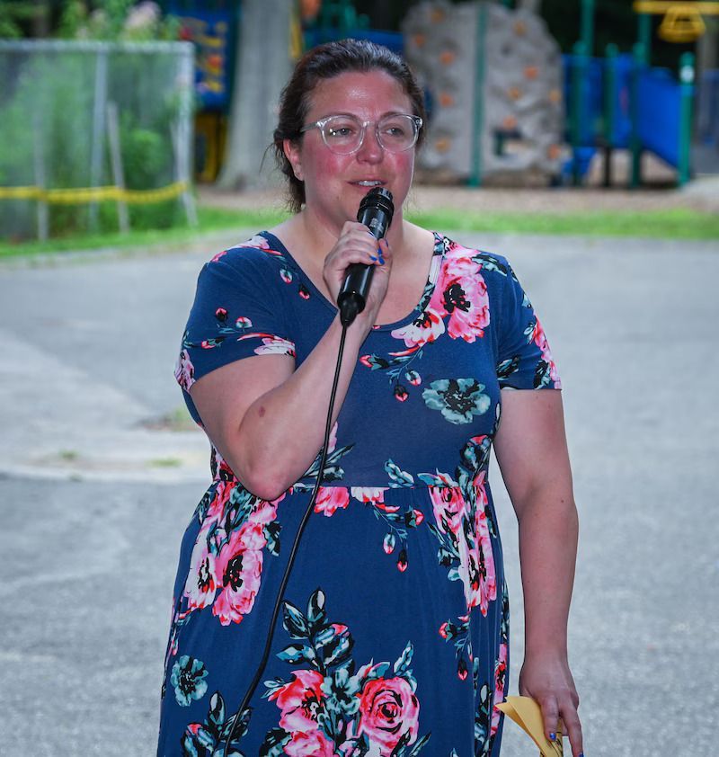 BHN kamp for kids opening day celebration - woman speaking at the event
