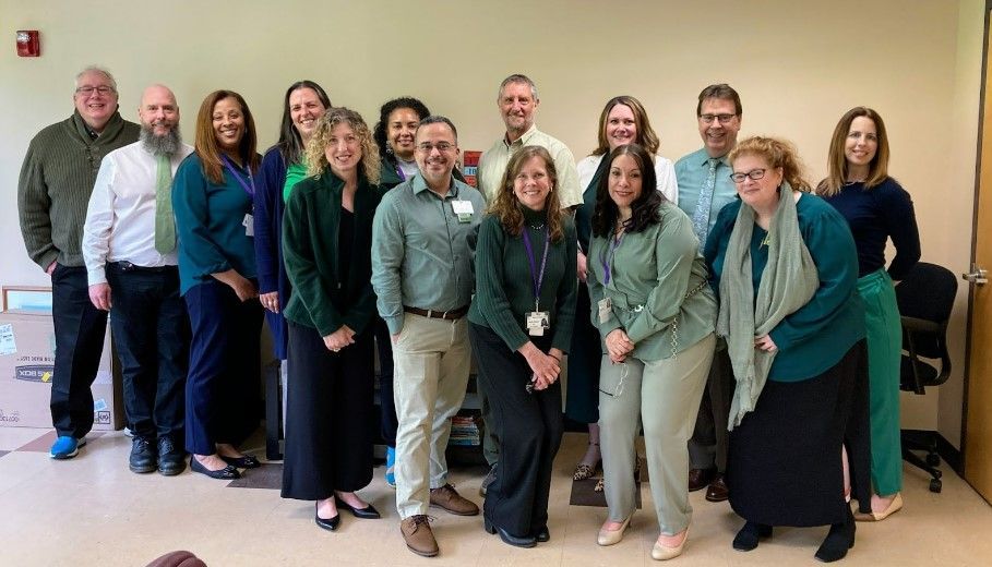 BHN leadership posing in green for mental health awareness month