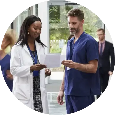 A man and a woman are looking at a piece of paper.