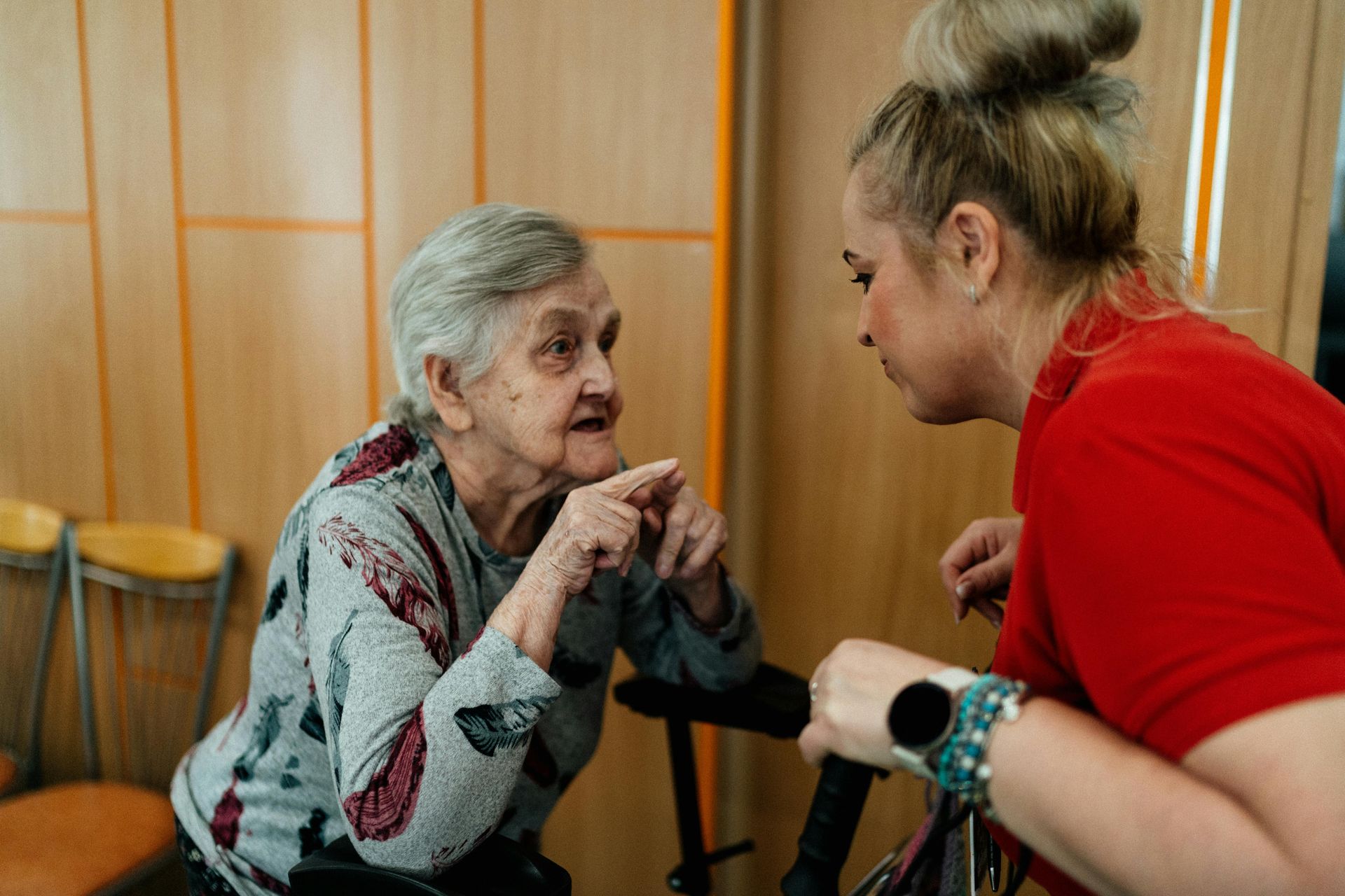 An elderly man getting his blood pressure measured.