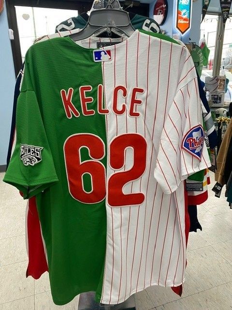 Kansas City jersey with “KELCE” and number 62, split green and white design on a hanger