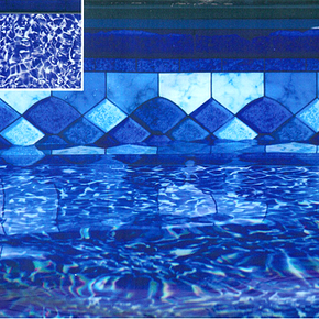 Blue tiled swimming pool water with a decorative mosaic border and a small inset close-up in the corner