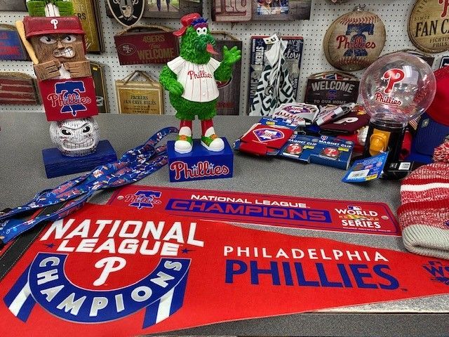 Philadelphia Phillies fan display with red, white and blue memorabilia and a large team banner.