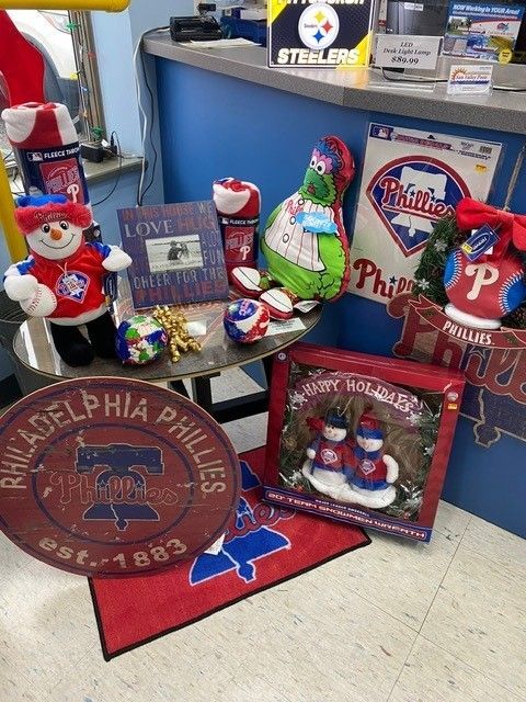 Philadelphia Phillies-themed holiday display with Santa figurines, ornaments, and red and blue team decor