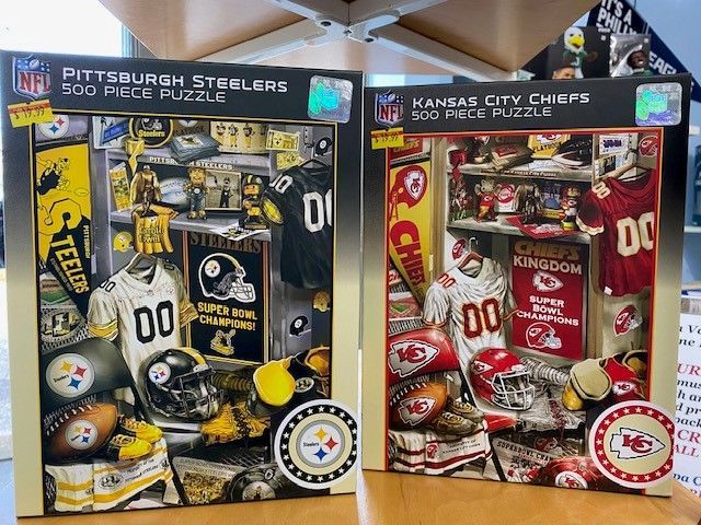 Pittsburgh Steelers and Kansas City Chiefs 500-piece sports puzzle boxes side by side
