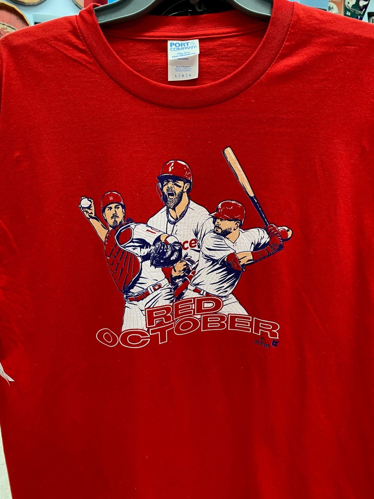 Red T-shirt with a baseball player graphic and “Red October” text on the chest