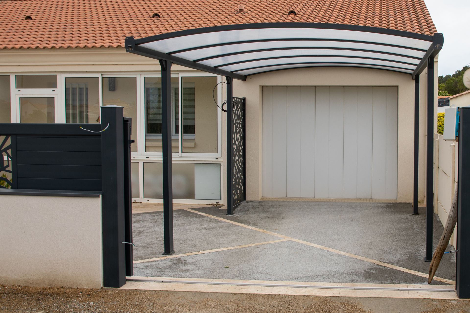 A house with a carport in front of it