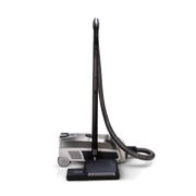Black upright vacuum cleaner with hose and floor head on a white background