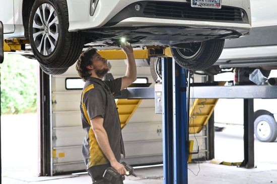 Mechanic Looking at Under Chassis | Auto Repair At The Hive