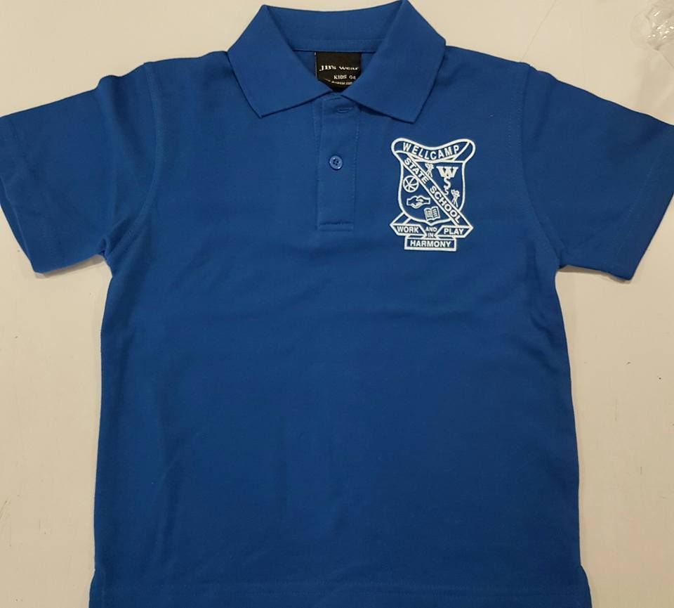 A Blue Polo Shirt With A Crest On The Front — Sportstar Screenprinting In Newtown, QLD
