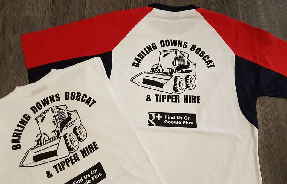 Two Shirts That Say Darling Downs Bobcat And Tipper Hire — Sportstar Screenprinting in Gatton, QLD