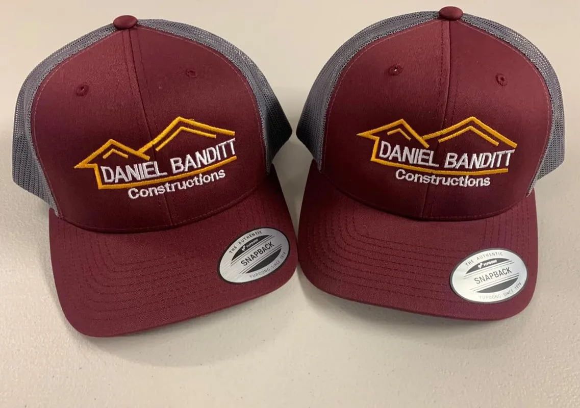 Two Daniel Bandit Construction Hats Are Sitting On A Table — Sportstar Screenprinting In Newtown, QLD