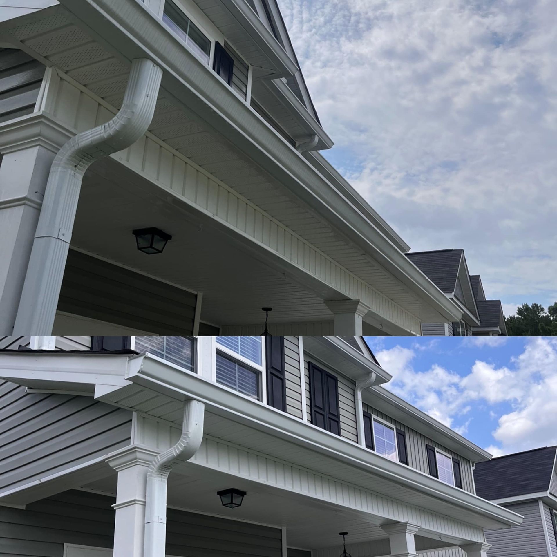 A house with a porch and gutters on it