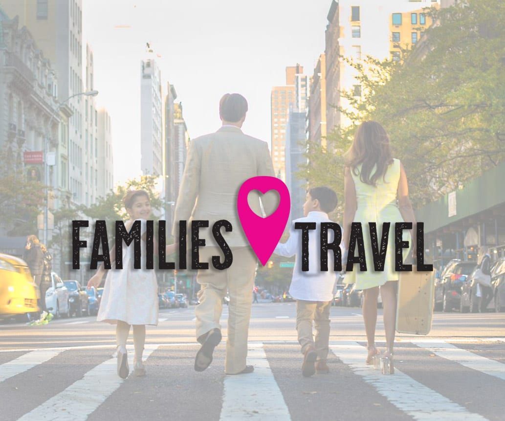 Family crossing a city street, with a pink location marker and the words 