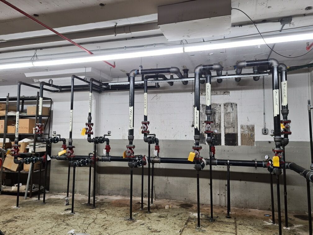 A row of pipes are lined up in a room.