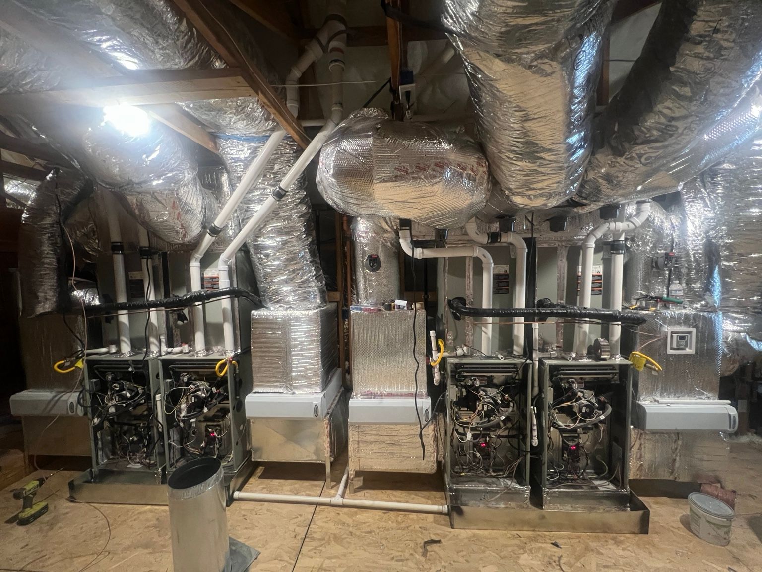 Four furnace systems arranged in two pairs with custom insulated ductwork and piping