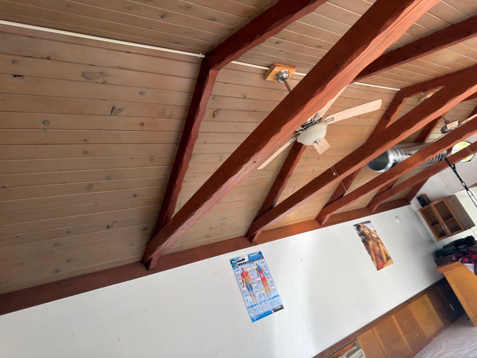 Ductwork along the ceiling beams — Capital City Comfort spiral duct installation