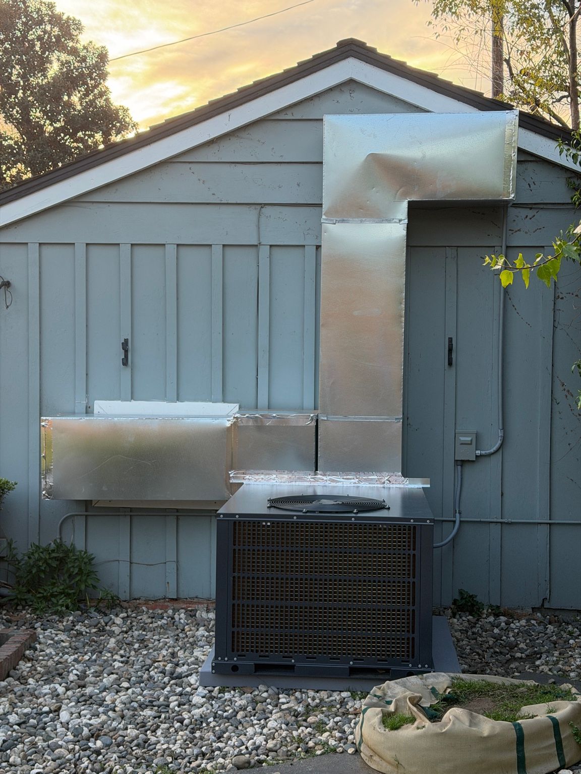 Full view of the completed custom duct installation and outdoor HVAC equipment
