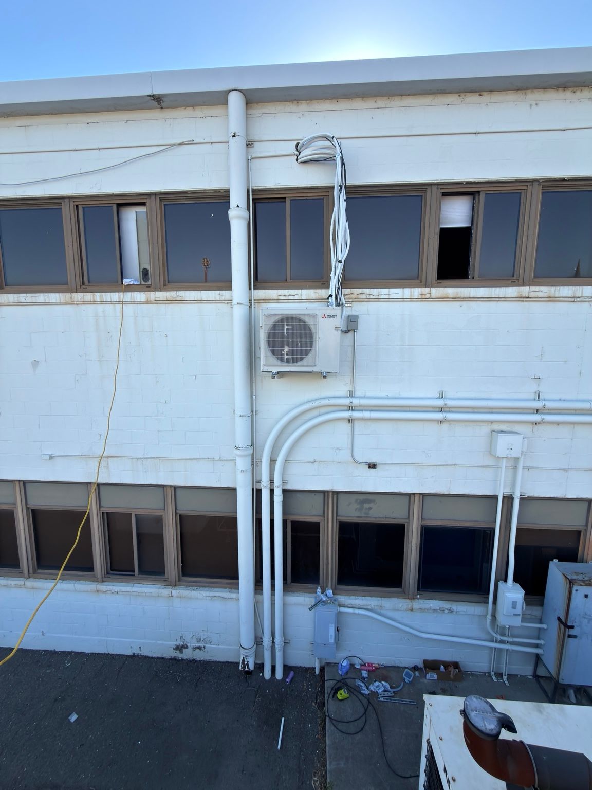 Building exterior and HVAC line routing during installation