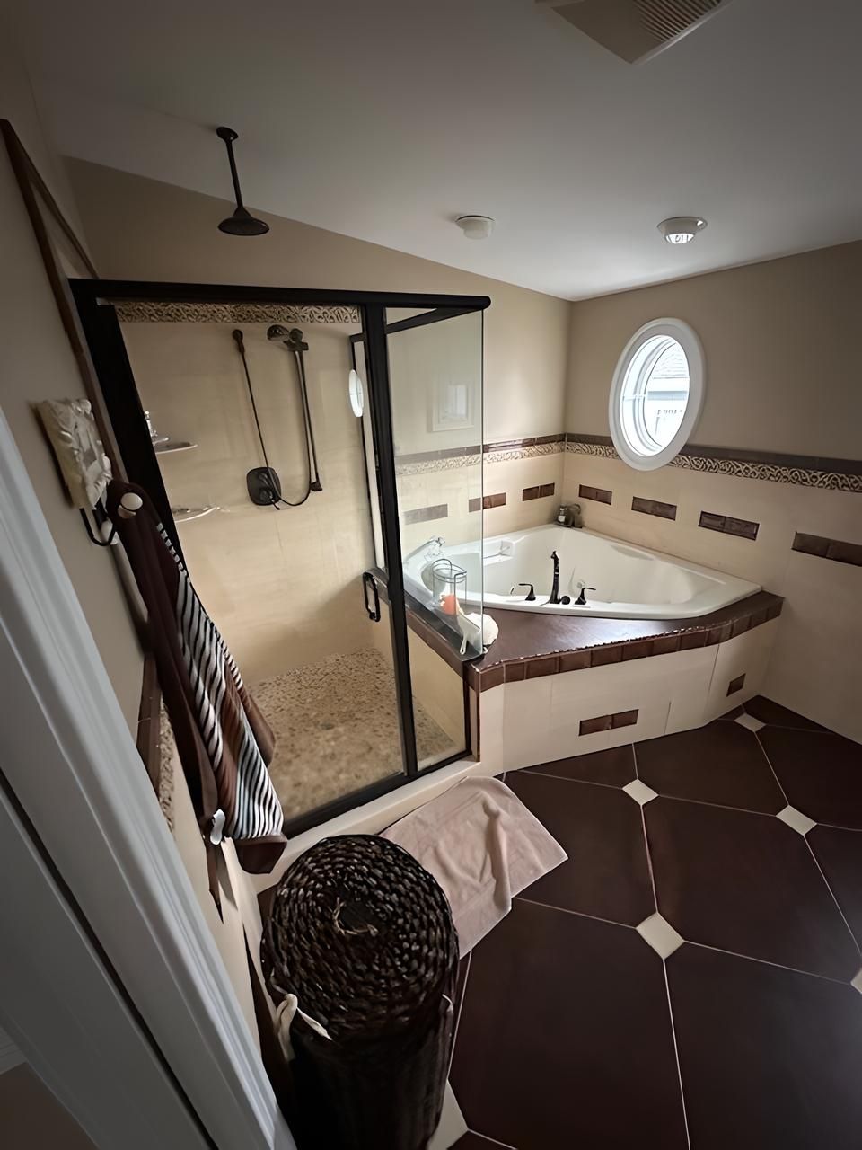 A bathroom with a jacuzzi tub and a walk in shower