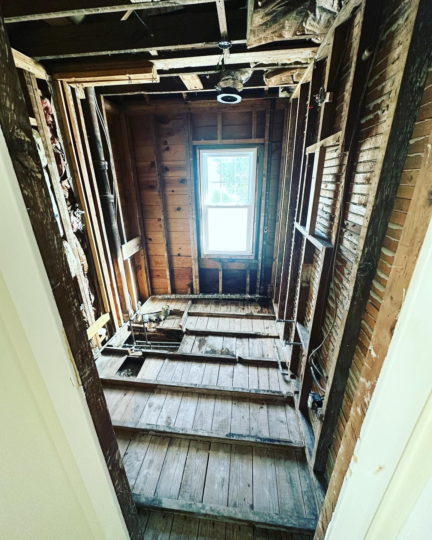 Looking up at the ceiling of a building with a window