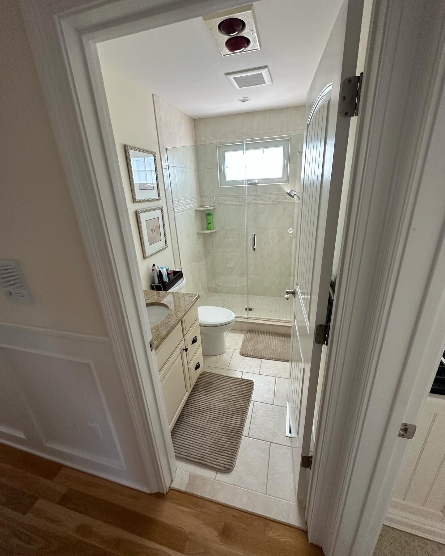 A bathroom with a toilet , sink , and shower