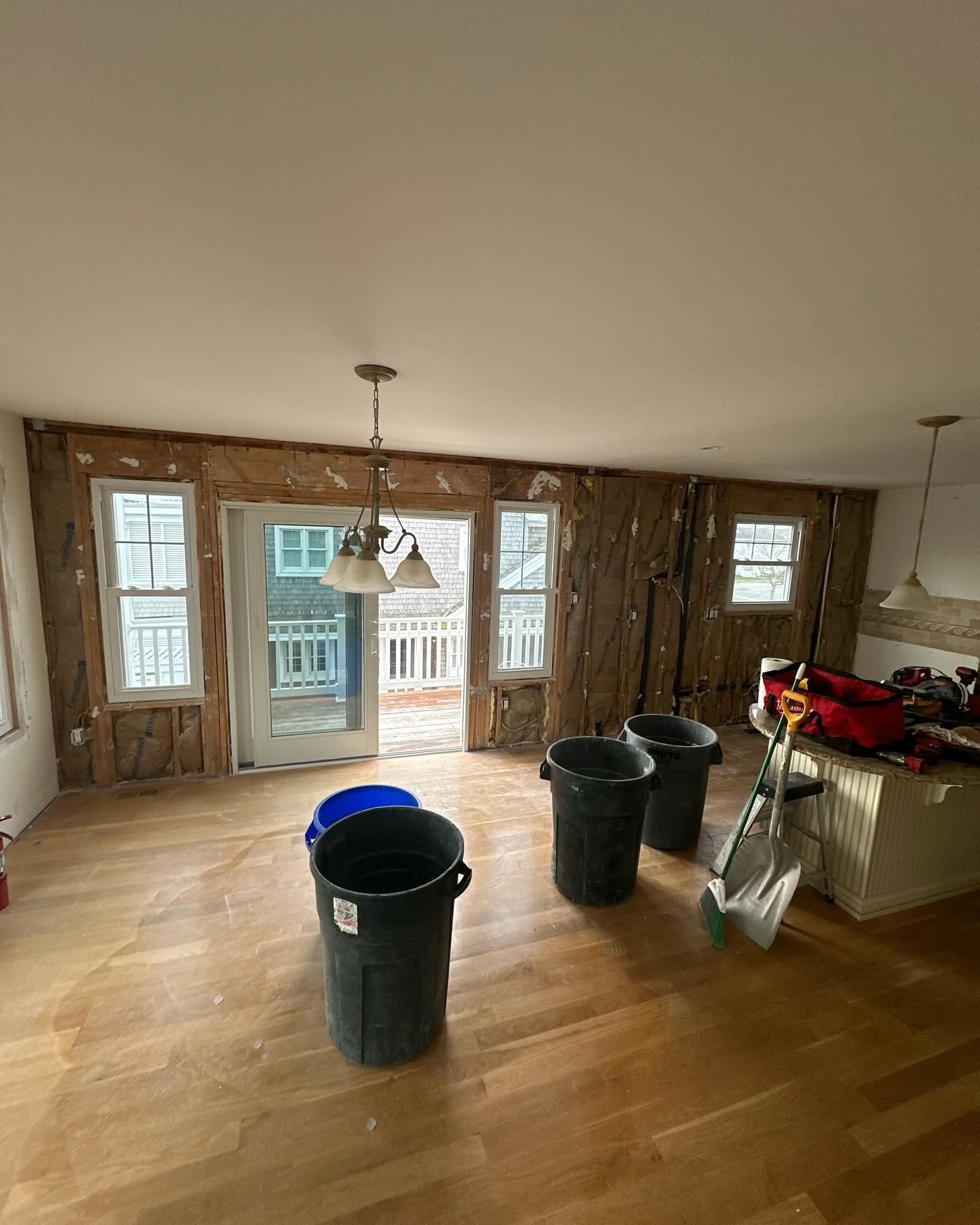 A room with a lot of trash cans in it