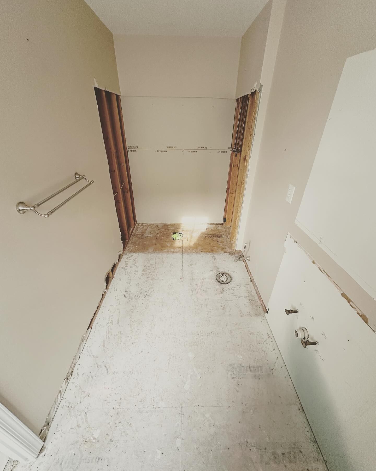 A hallway with a door that is missing