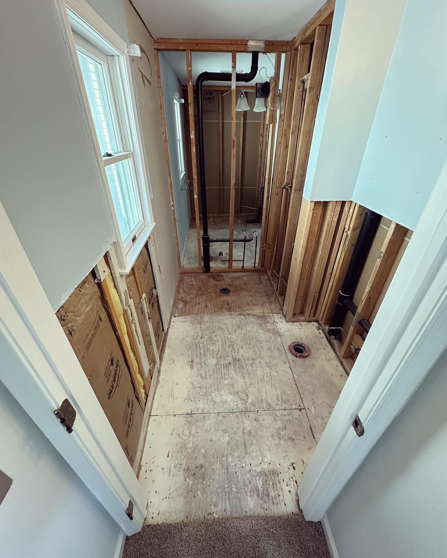 A hallway in a house that is being remodeled