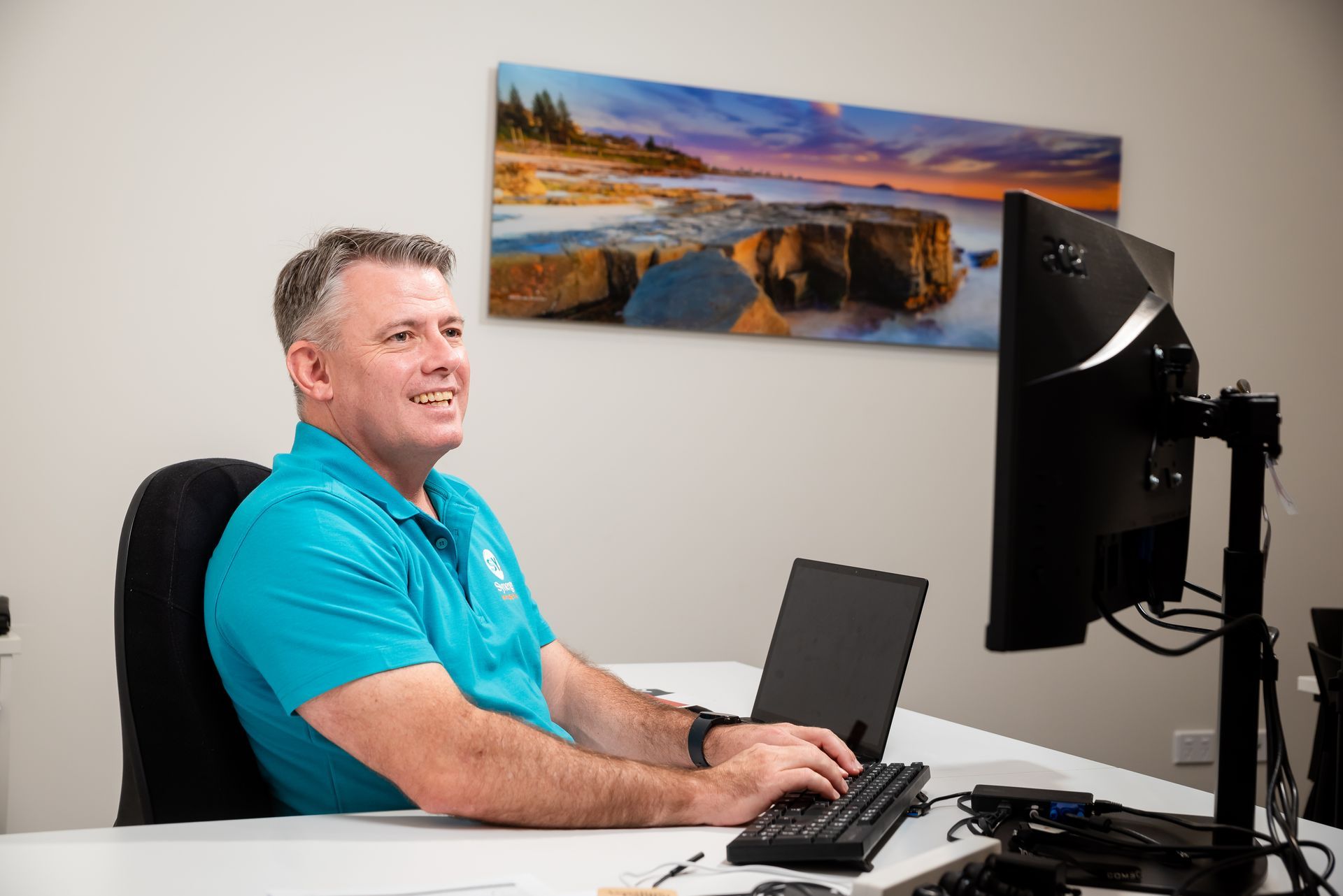 Synergy Mortgage Brokers Director Brendan Philp working on client file