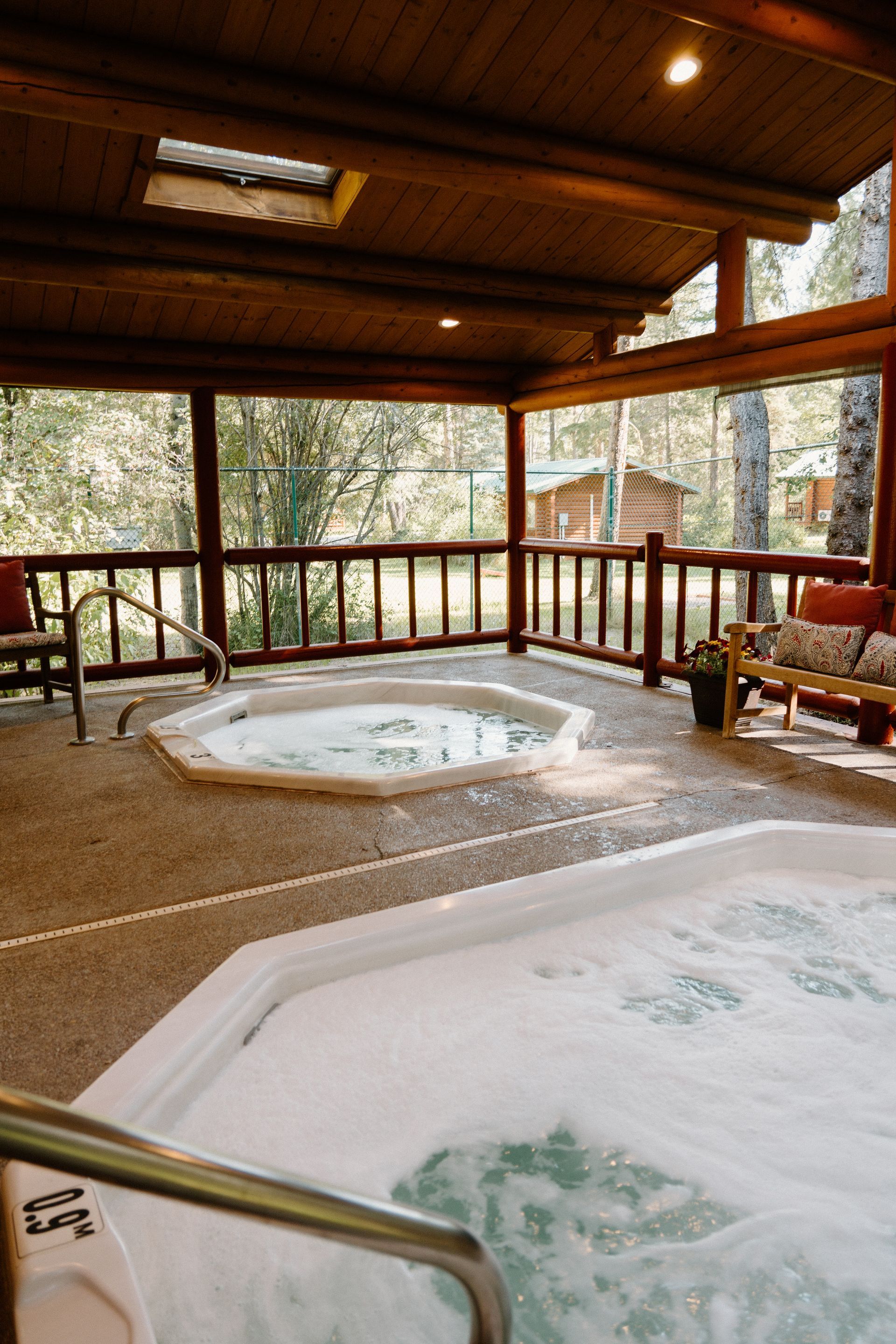There is a hot tub in the middle of the room.