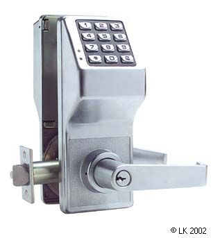 A stainless steel door lock with a key on it