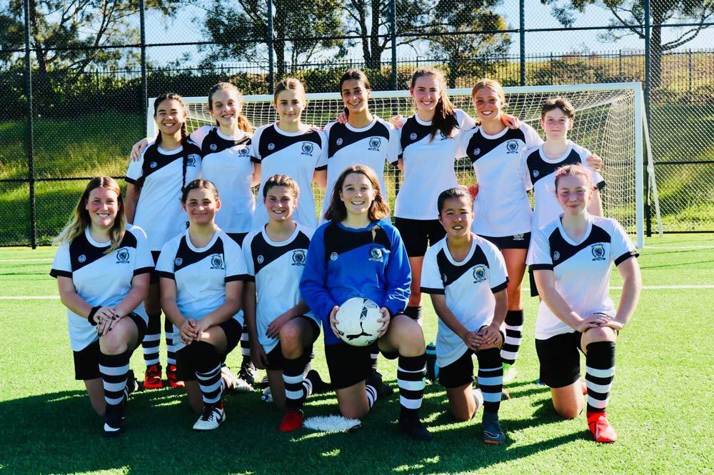 Football Players Wearing Custom Jersey and Stripes Socks — Promotional Apparel In Shellharbour, NSW