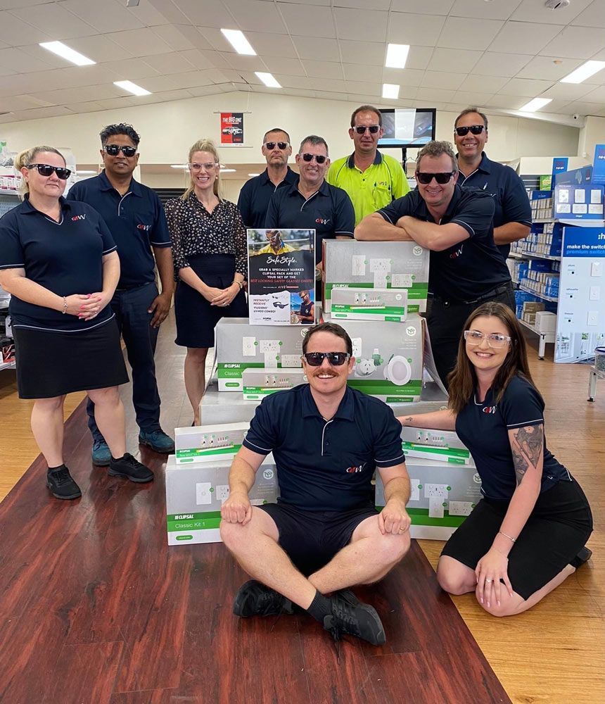 Employees Wearing Polo Shirts And Eye Glasses With Custom made accessories— Promotional Apparel In Kiama, NSW