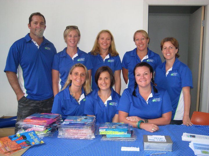 Team Members Sporting Stylish Blue Polo Shirts — Promotional Apparel In Woonona, NSW