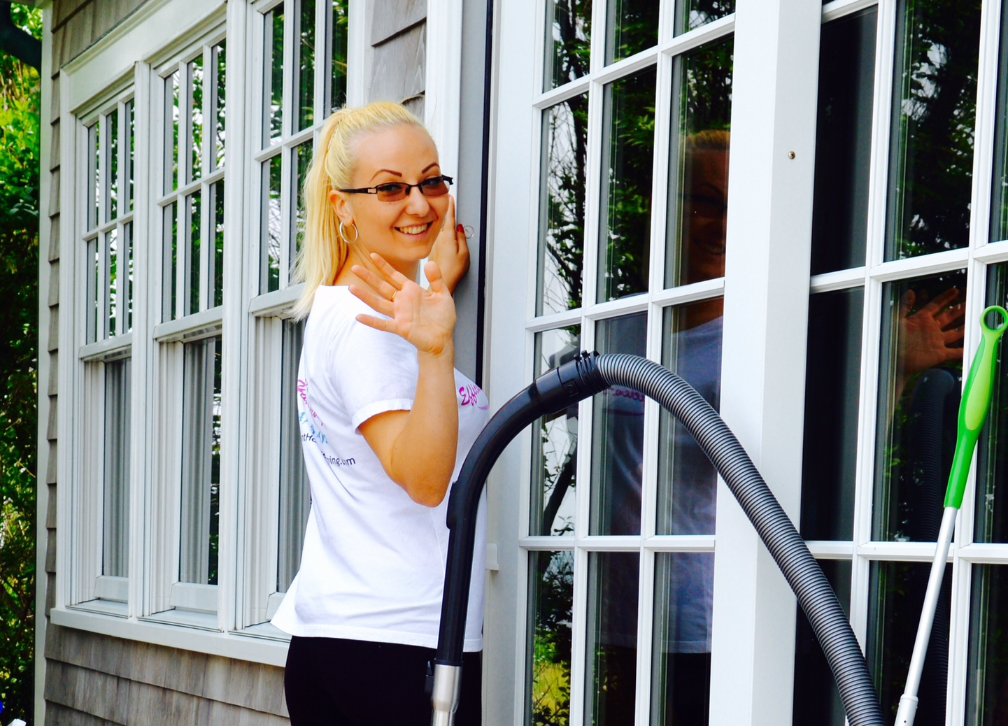 Woman Vacuuming Couch — Falmouth, MA — Efficient Housekeeping
