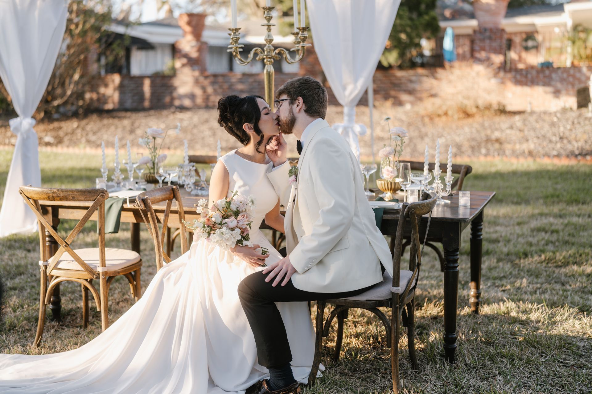 Bride and Groom kissing during wedding reception.