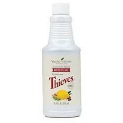 A white bottle of Young Living Thieves Household Cleaner with a lemon and herb label on a white background.