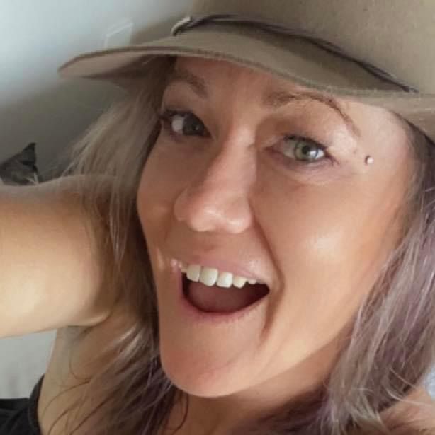 Selfie Picture of Woman with Brown Cap — Graphic Designer In Airlie Beach, QLD
