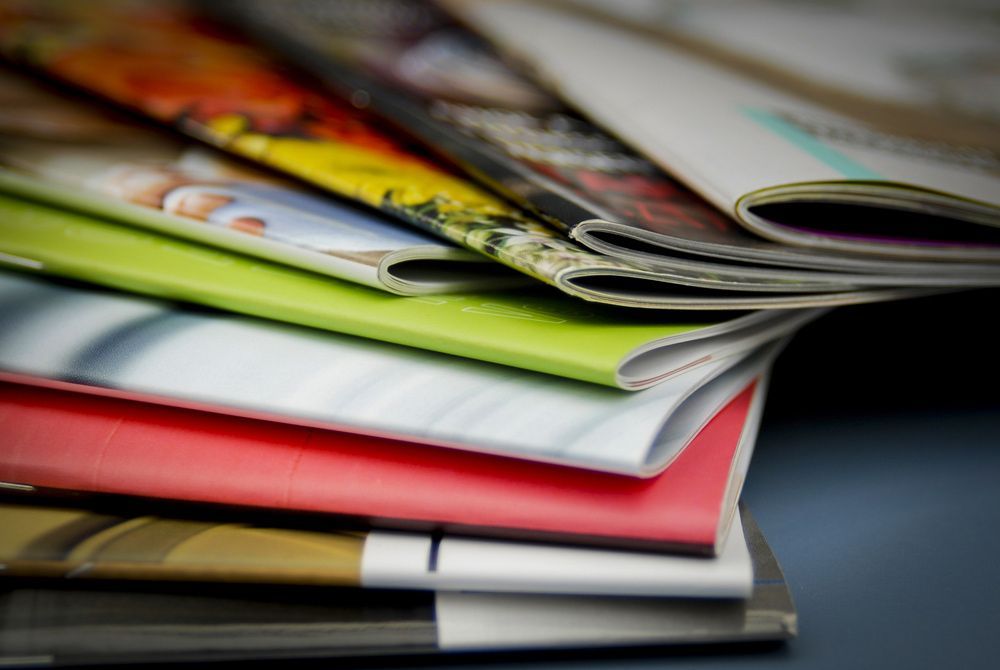 Close Up View Of Brochures — Graphic Designer In Airlie Beach, QLD