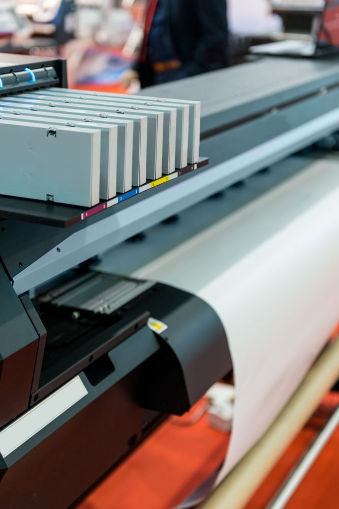 Close Up View Of Printing Machine — Graphic Designer In Airlie Beach, QLD