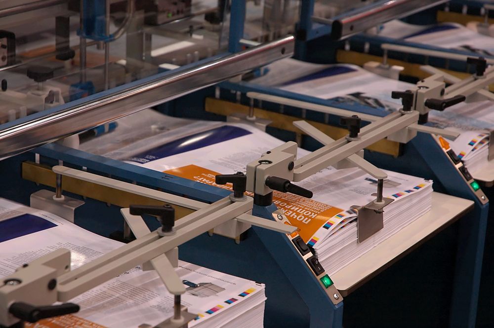 Pile Of Printed Papers — Graphic Designer In Bowen, QLD