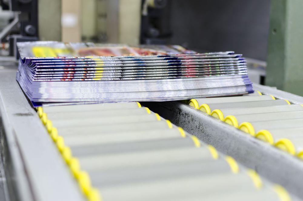 Printing Magazine During Finishing Line — Graphic Designer In Moranbah, QLD