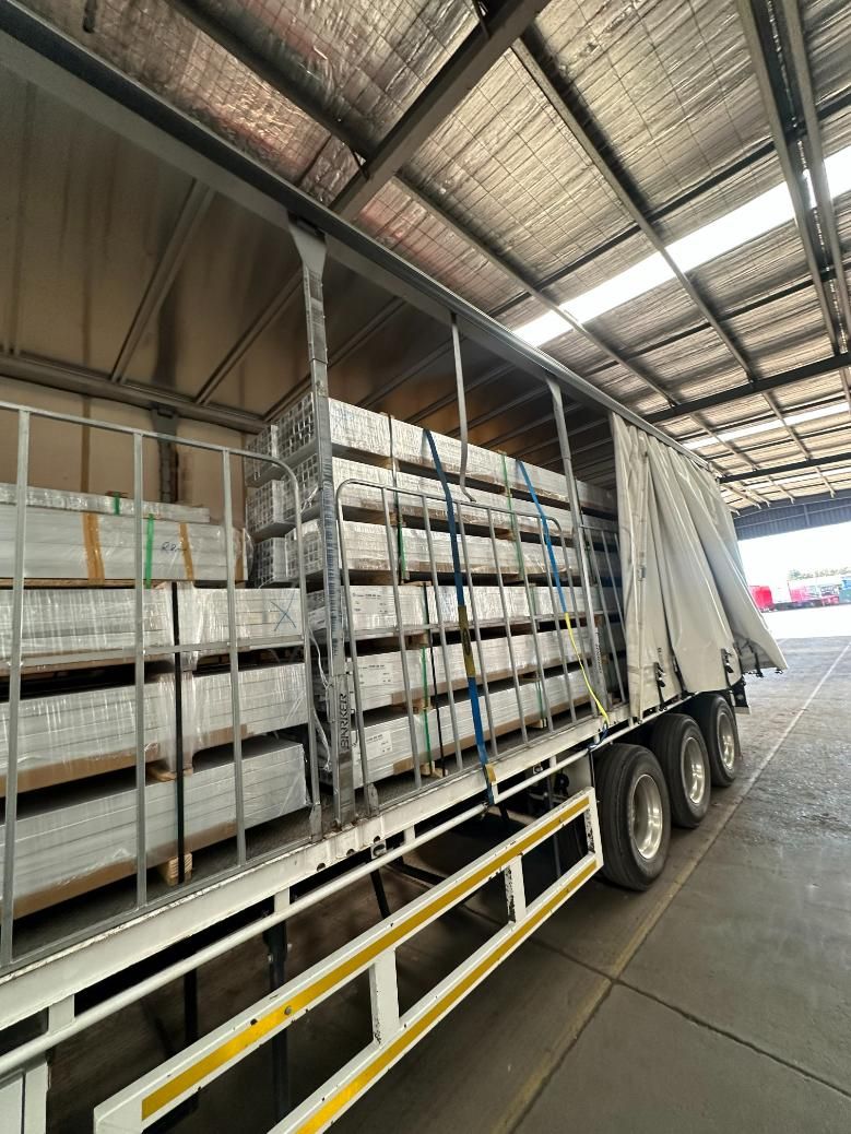 A Truck is Loaded With a Lot of Boxes in a Warehouse — Goulburn Transport In Melbourne, VIC