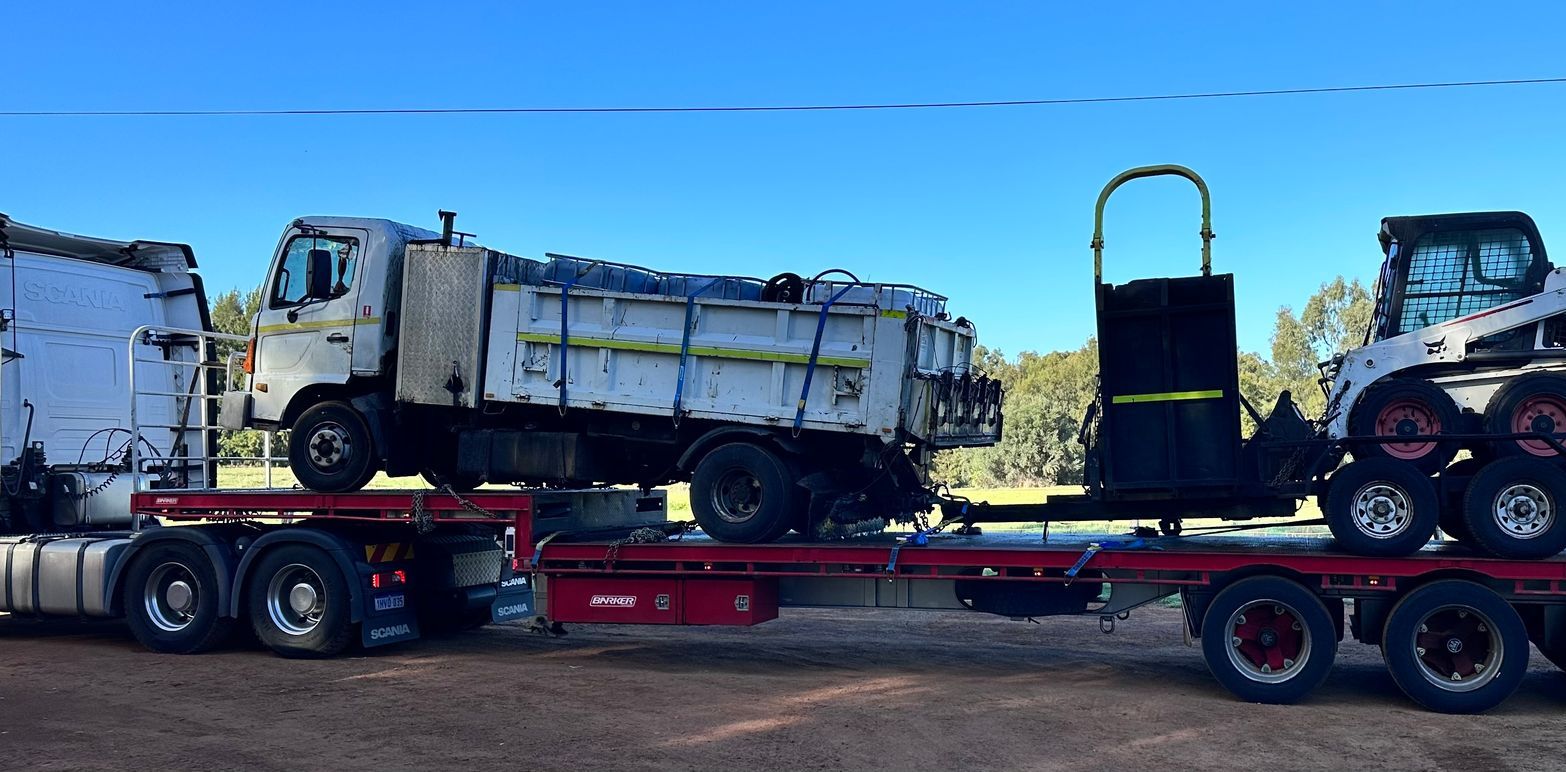 A White Truck is being transported — Goulburn Transport In Goulburn, NSW