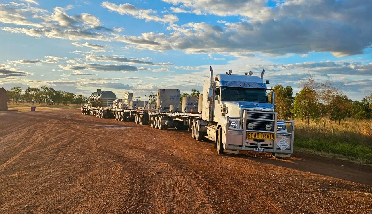 A White Truck With a Yellow Sign on the Front That Says Oversize — Goulburn Transport In Goulburn, NSW