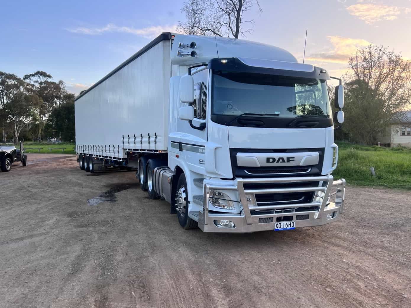 A White Semi Truck is Parked in a Dirt Lot — Goulburn Transport In Goulburn, NSW