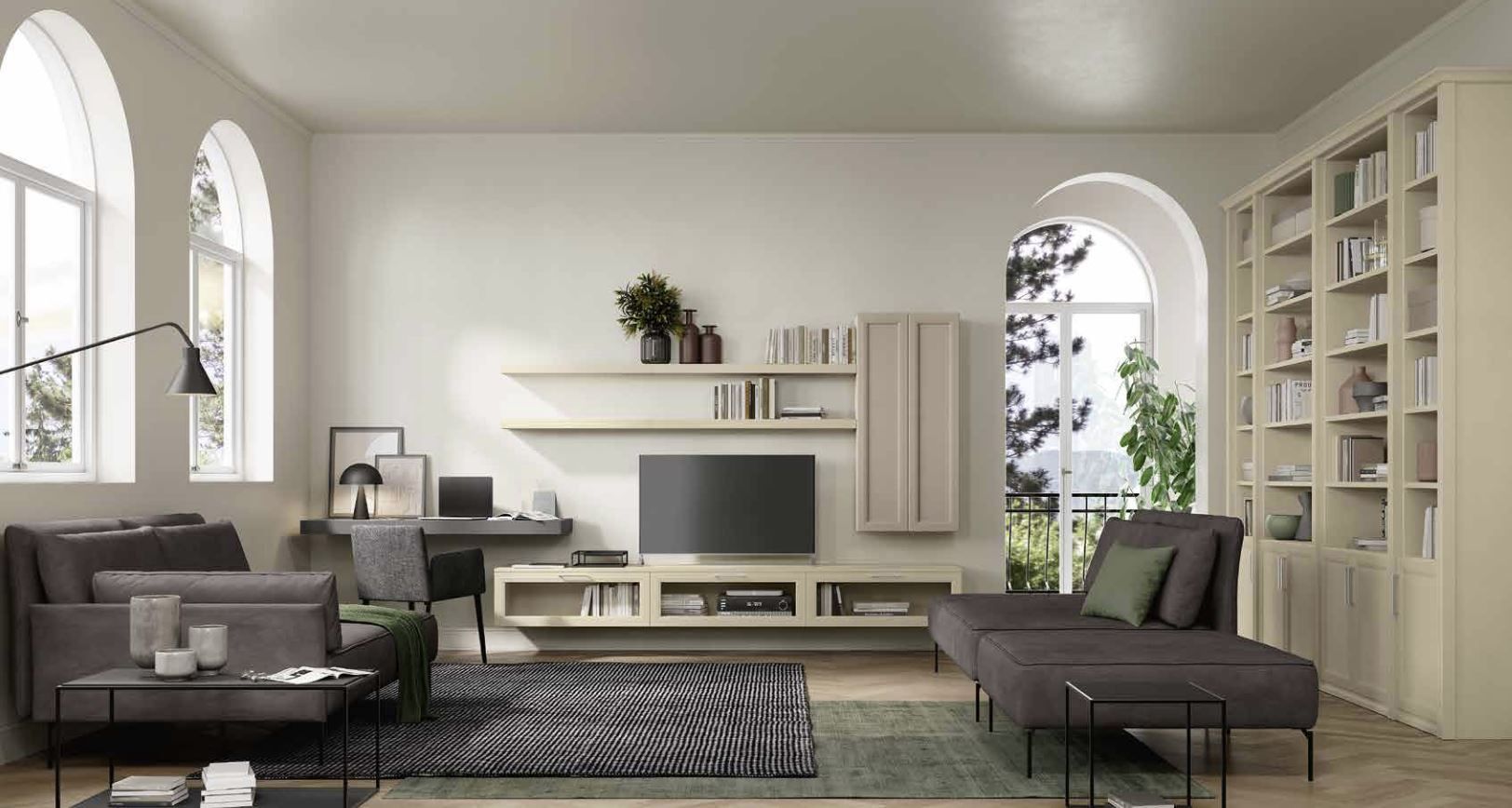 Soggiorno moderno con divani grigi, mobile TV, librerie e finestre ad arco in un luminoso ambiente dai colori neutri.