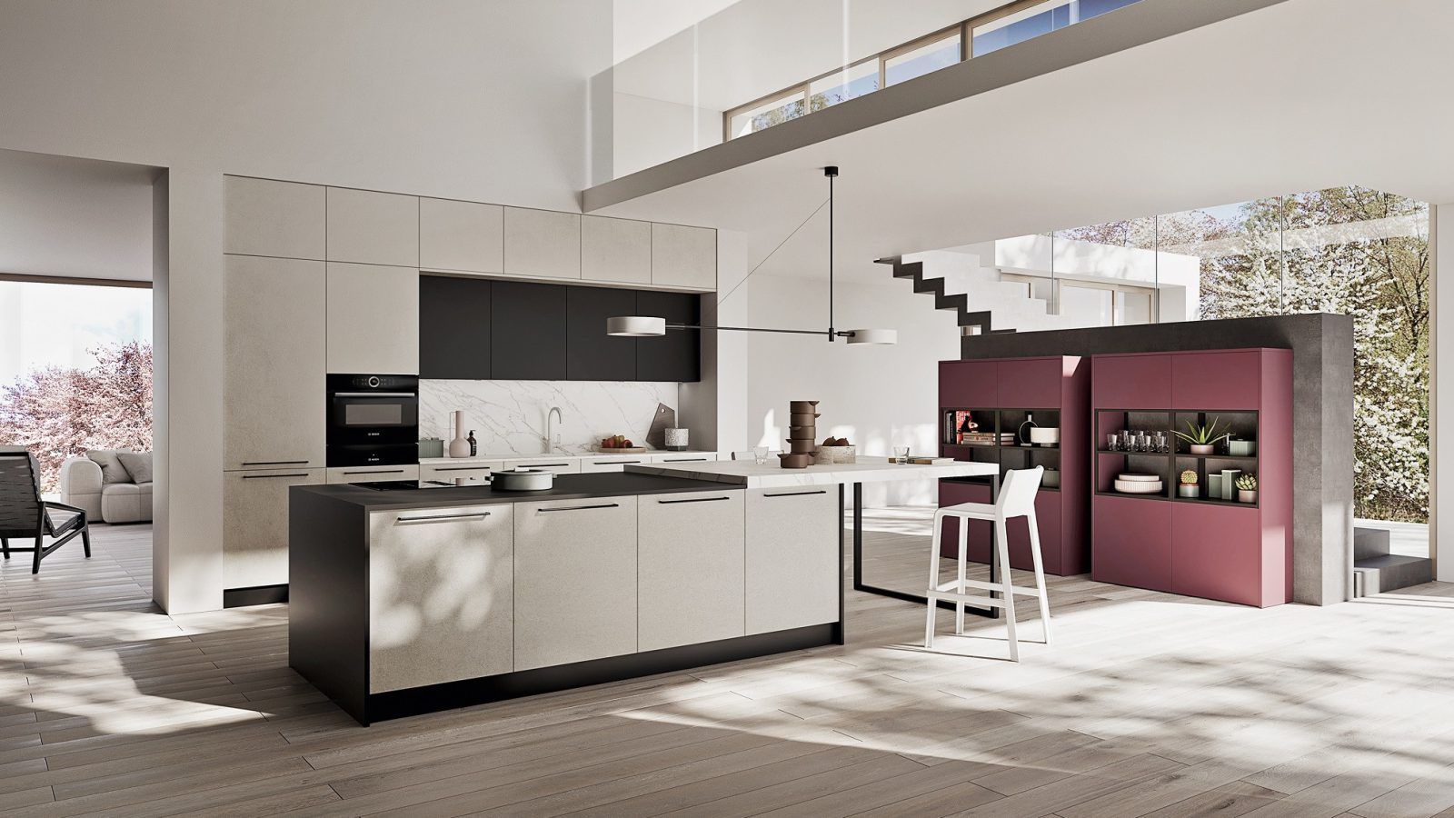 Cucina moderna a pianta aperta con isola, scala e angolo bar color bordeaux in una luminosa casa contemporanea.